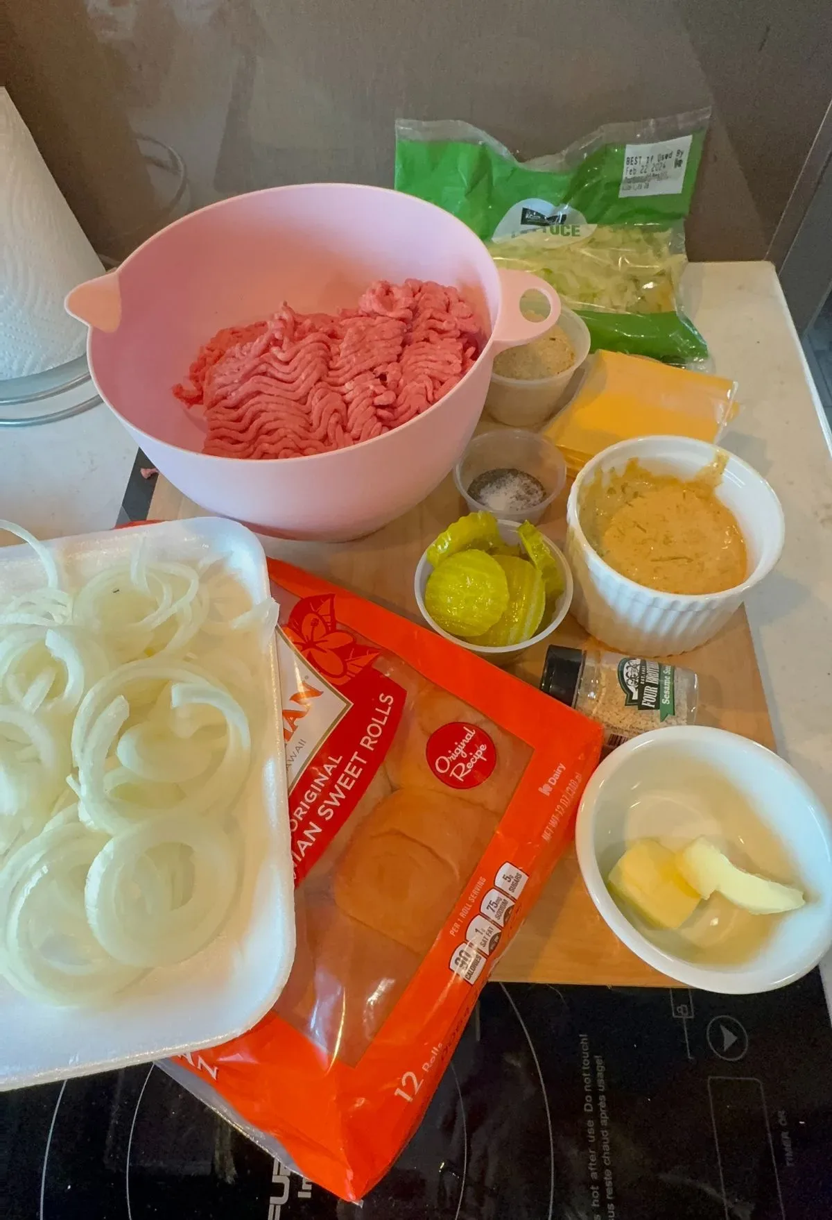 The ingredients for a ham and cheese sandwich on a counter.