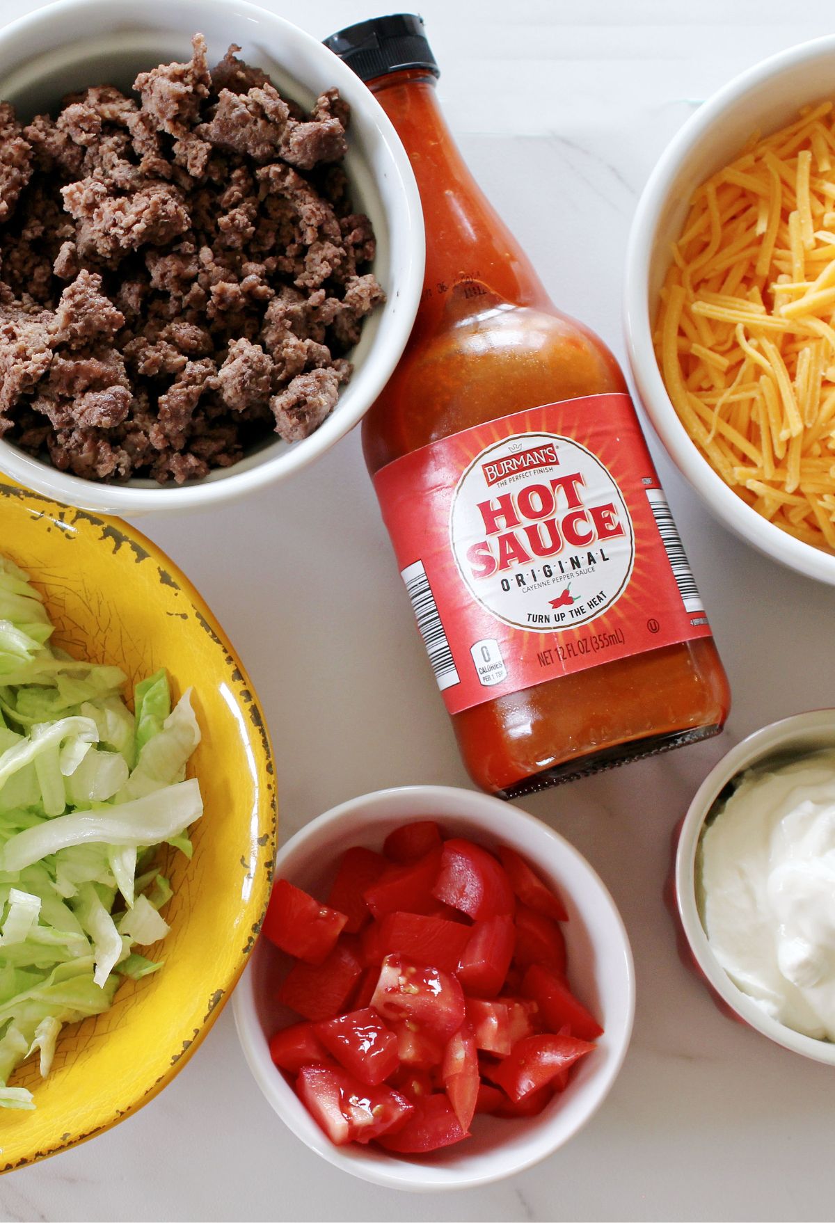 Hot and sour soup ingredients on a white table.