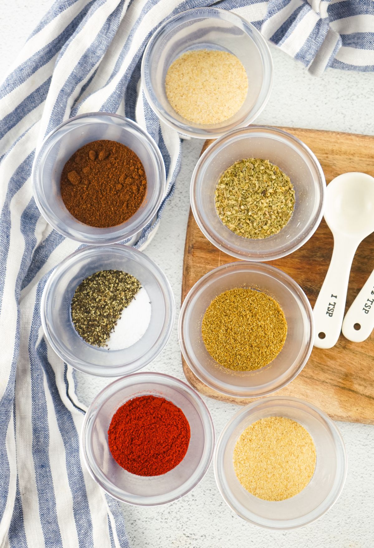 Cheesy gordita crunch taco spices on a wooden cutting board.